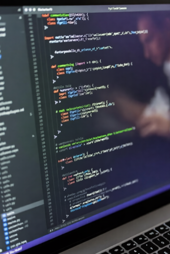 AI generating computer code on a laptop screen