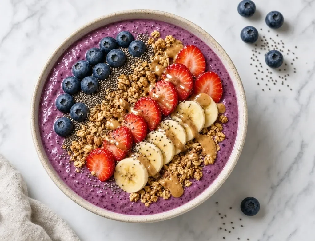 Protein Boosted Foods:berry smoothie bowl with Greek yogurt, fruit, granola and almond butter